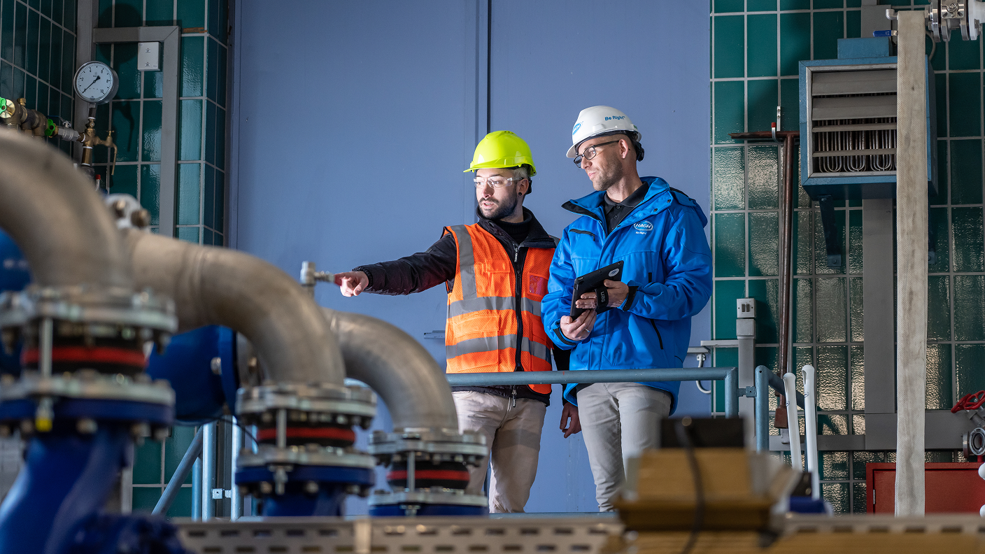 Hach field service experts inspecting treatment equipment